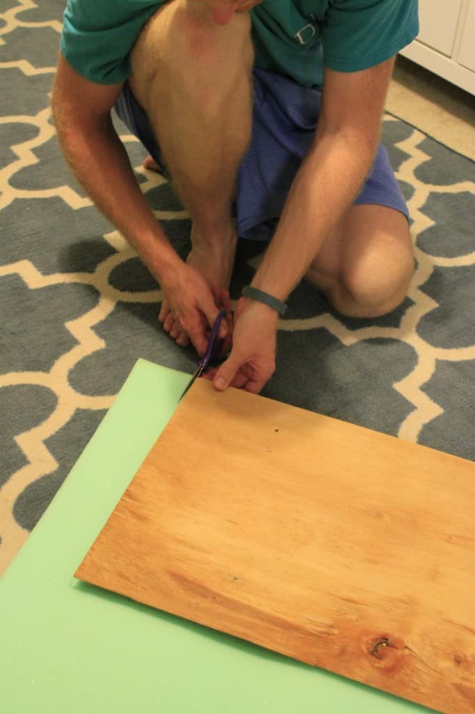 A photo of the foam being cut to size using scissors. 