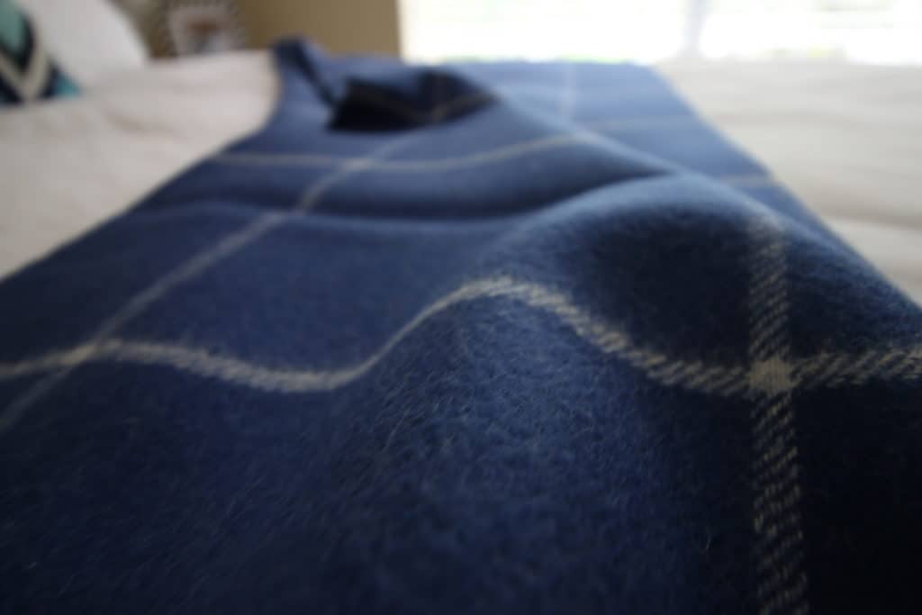 how to style a throw blanket on a bed - charleston crafted