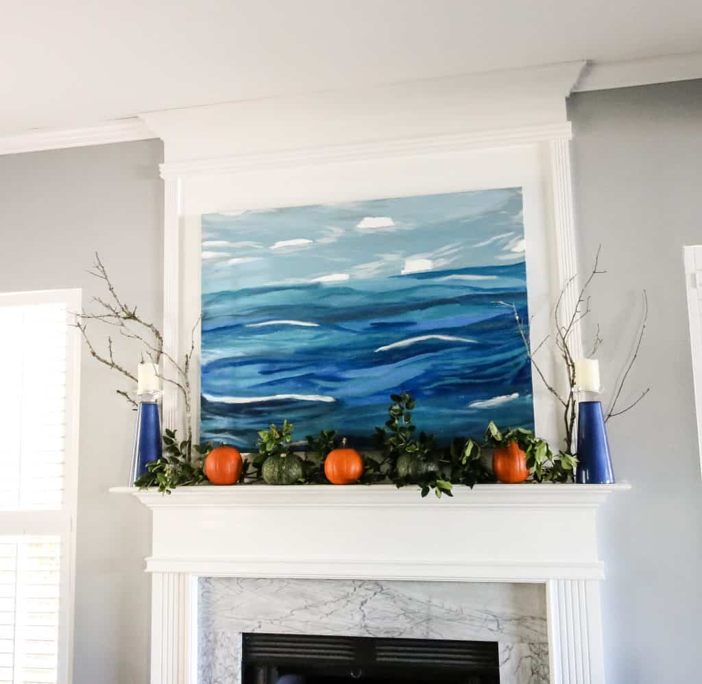 Simple Fall Mantel with pumpkins and greenery via Charleston Crafted