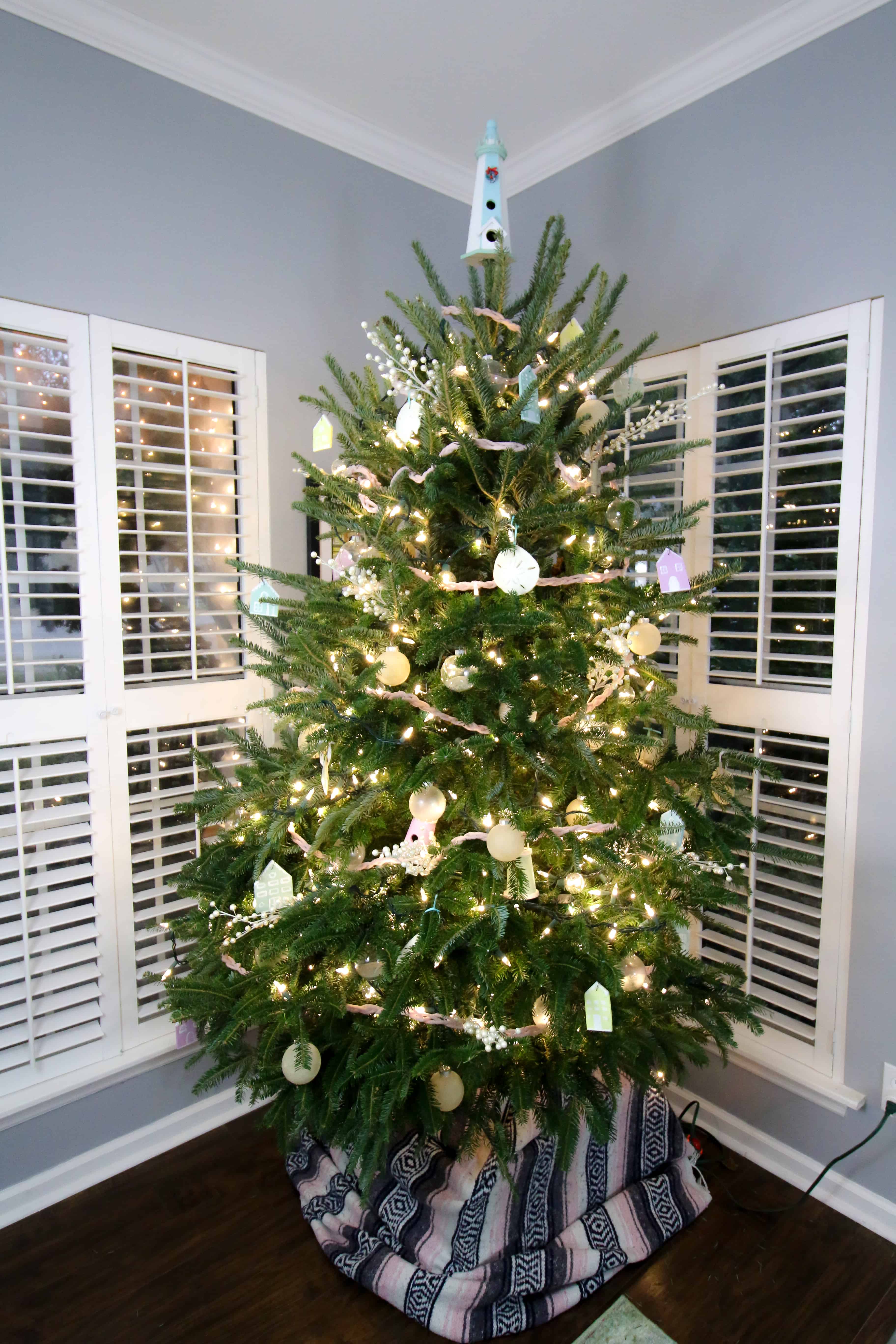 Charleston Coastal Christmas Tree with sand dollars, pastel houses, and beach ornaments