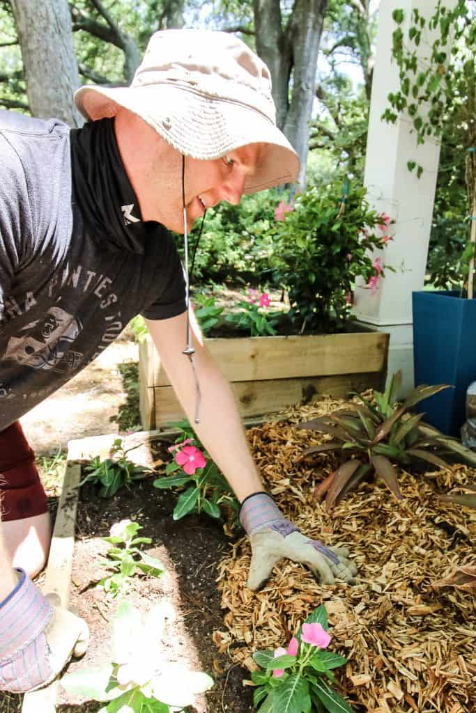 adding mulch to the Front yard flower bed