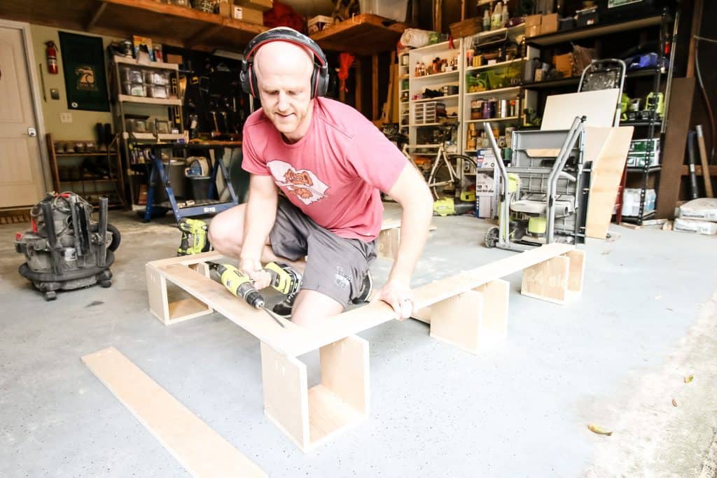 Assembling wall-mounted scrap wood storage