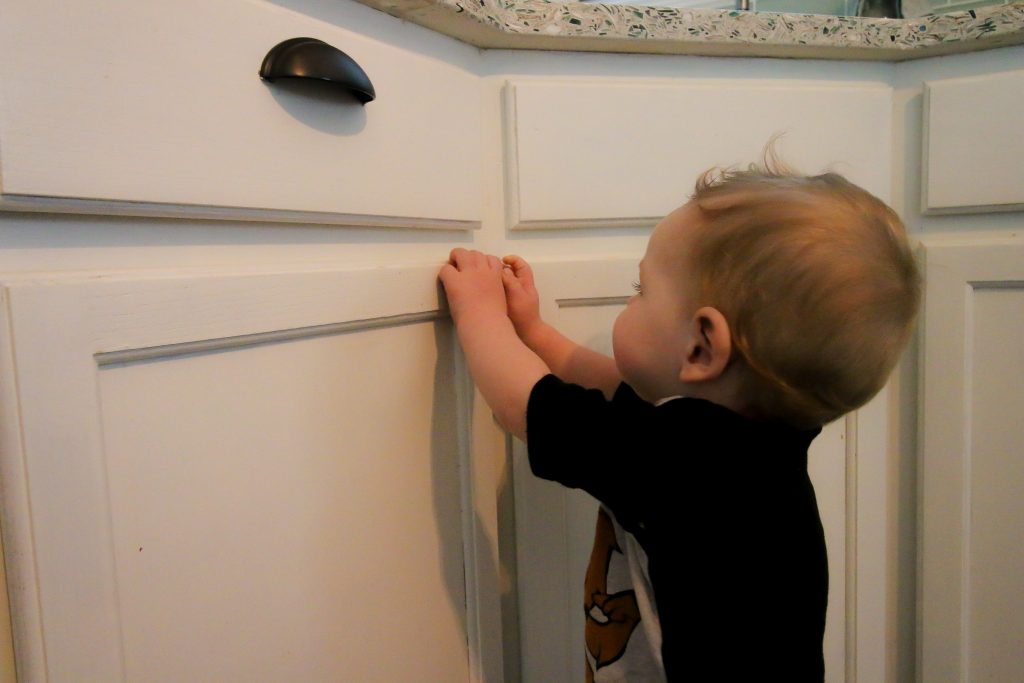 Kid can't open cabinet with Eco Baby Magnetic Safety Locks