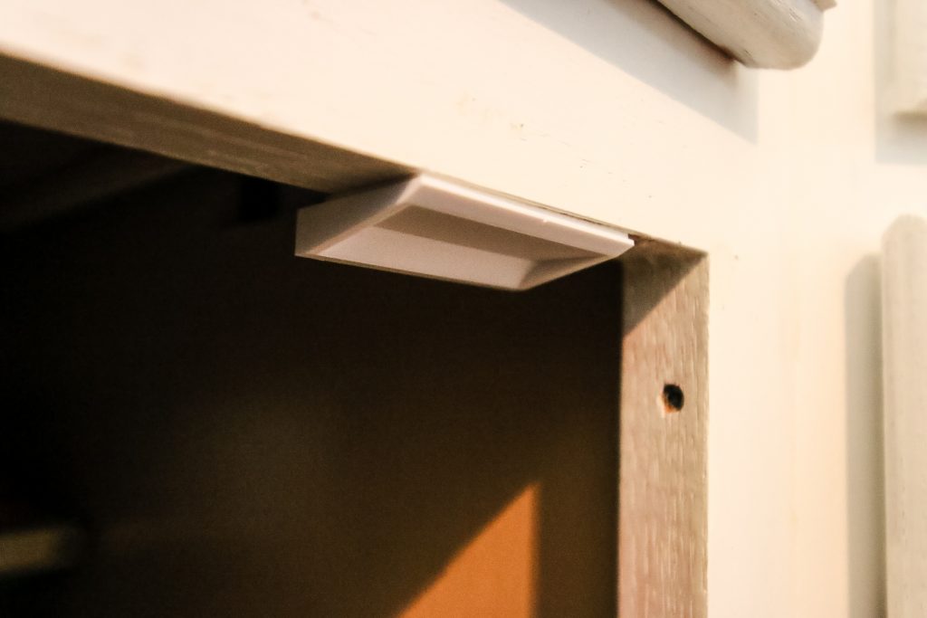 Attached lock catch inside cabinet