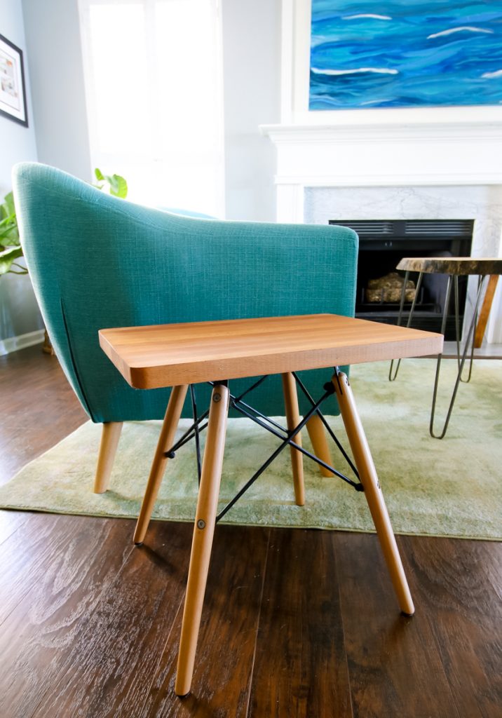 side table made from a cutting board and chair legs