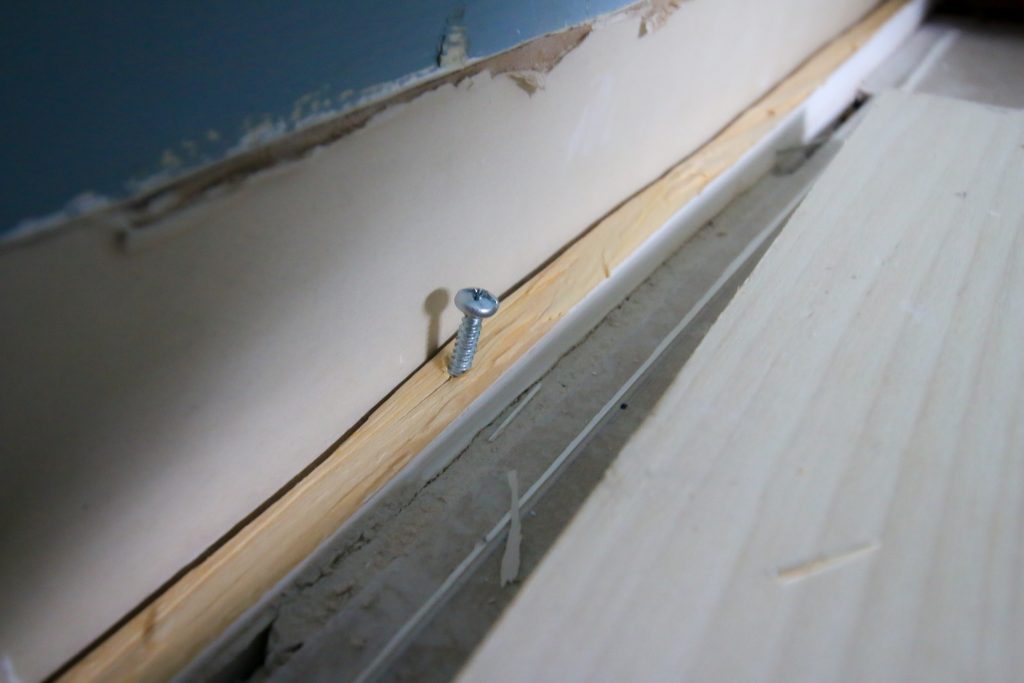 Screw in baseboard