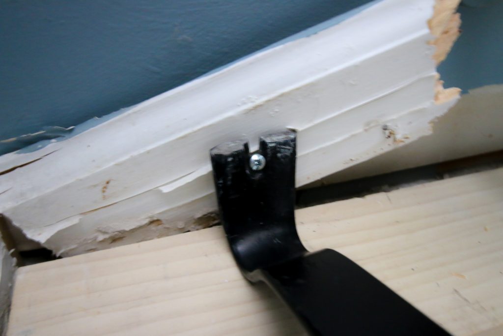 Leverage baseboard out with pry bar