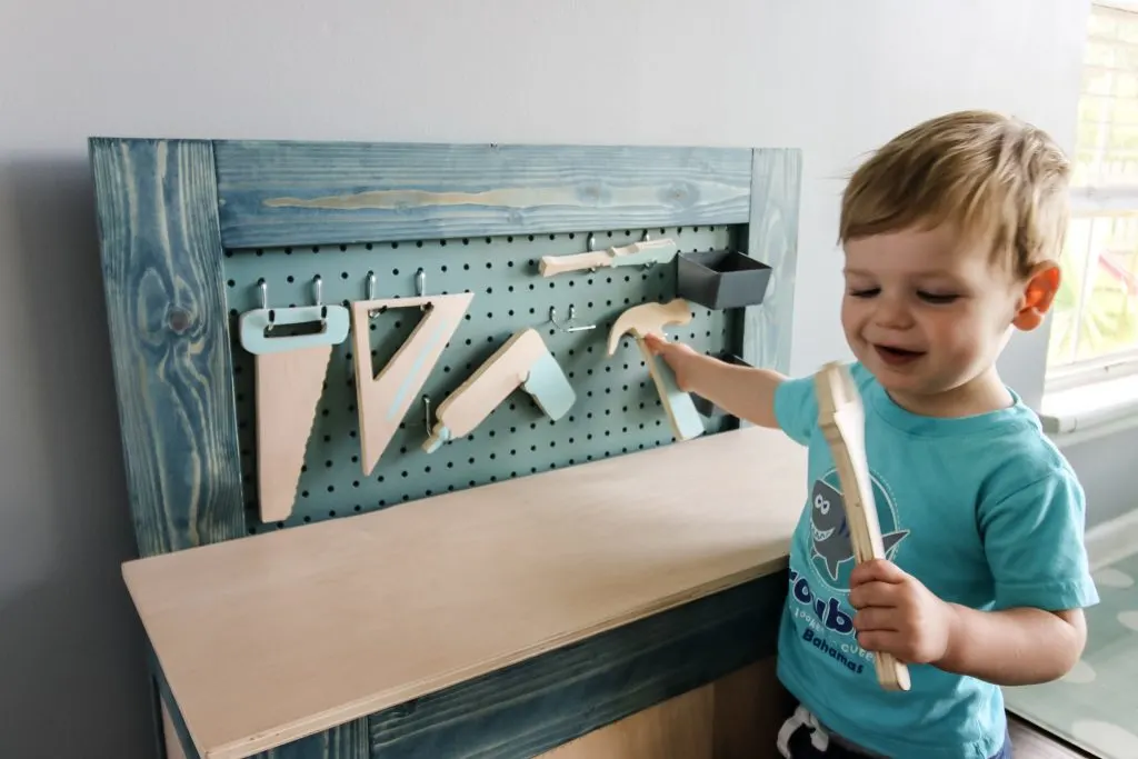Playing with toddler workbench