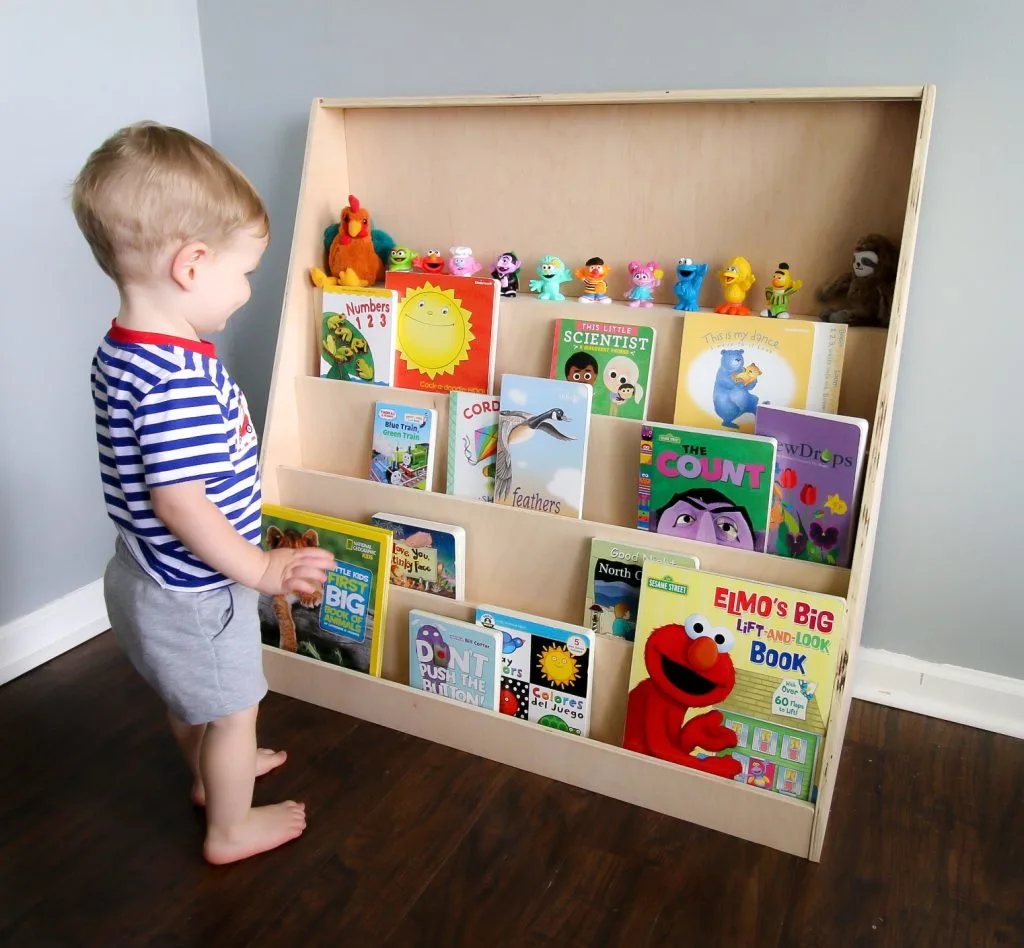 Toddler with front facing bookshelf