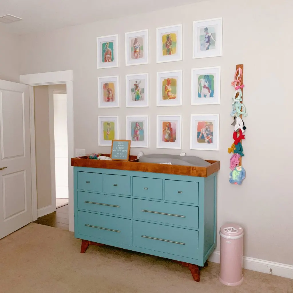 Sherwin Williams Agreeable Gray in a Bedroom with blue dresser