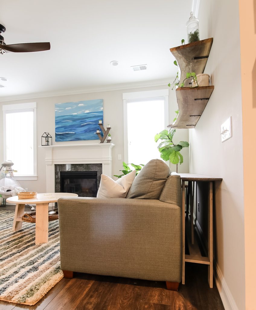 Console table behind couch