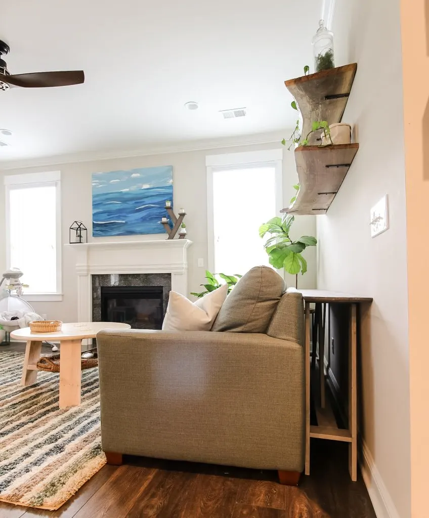 Console table behind couch