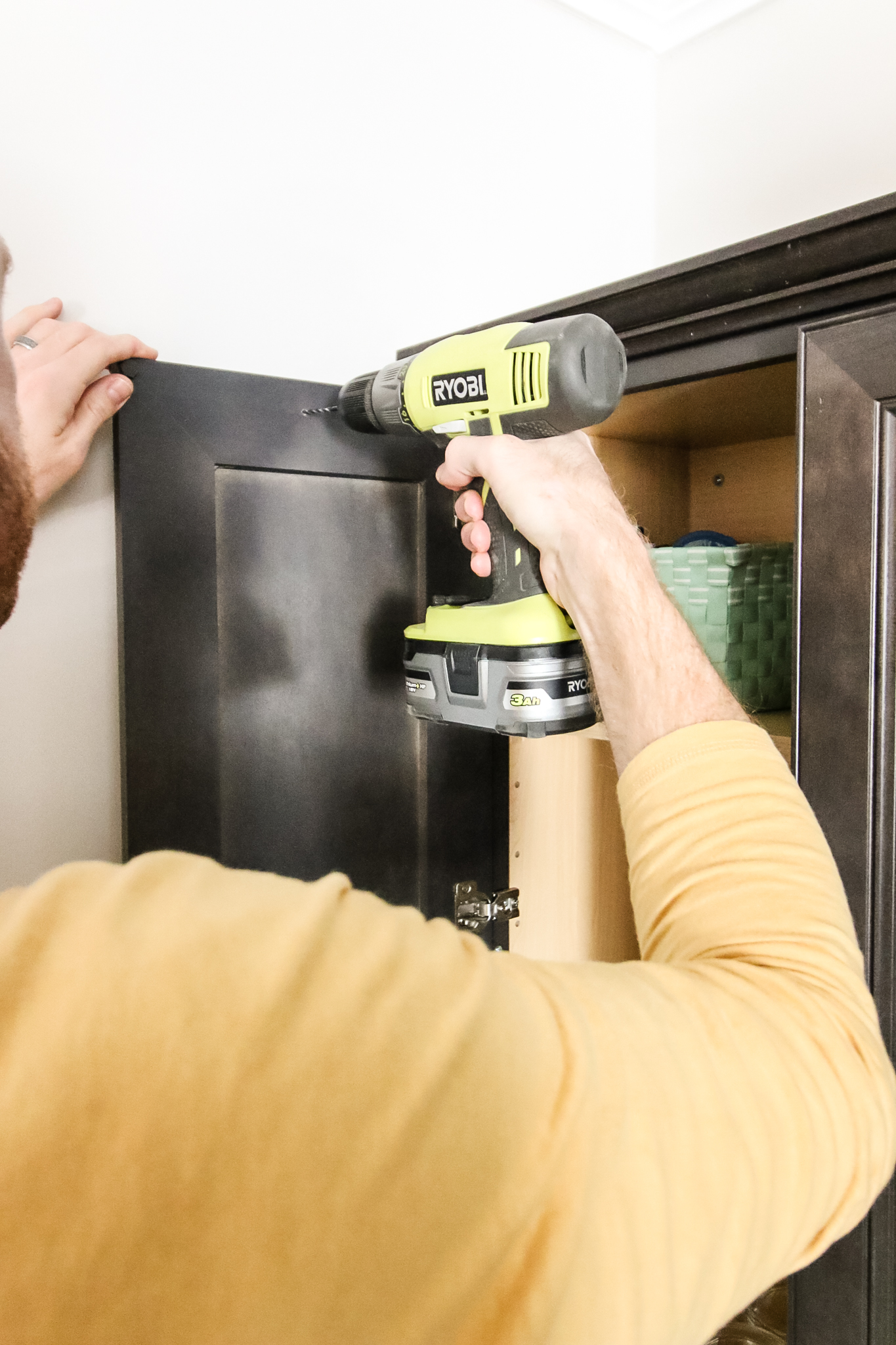 screw cabinet restraint into cabinet door