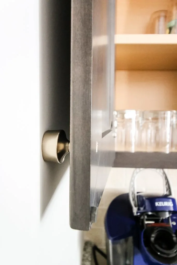 cabinet door banging into the wall