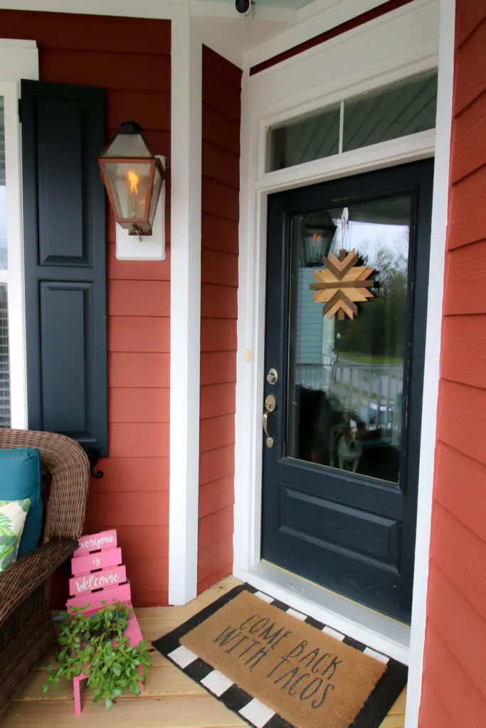 Wooden showflake hanging on door