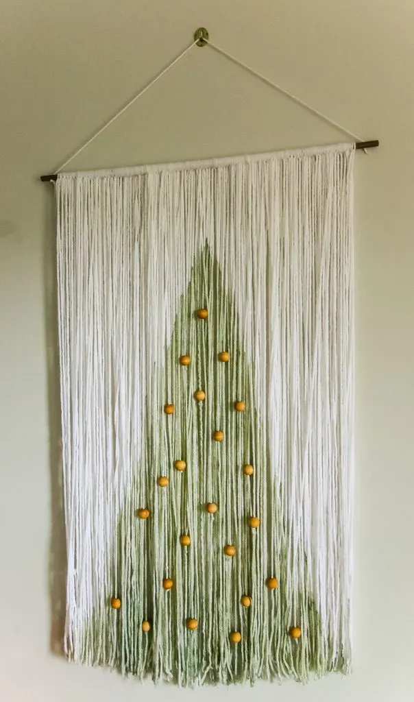 Christmas yarn and wood wall hanging