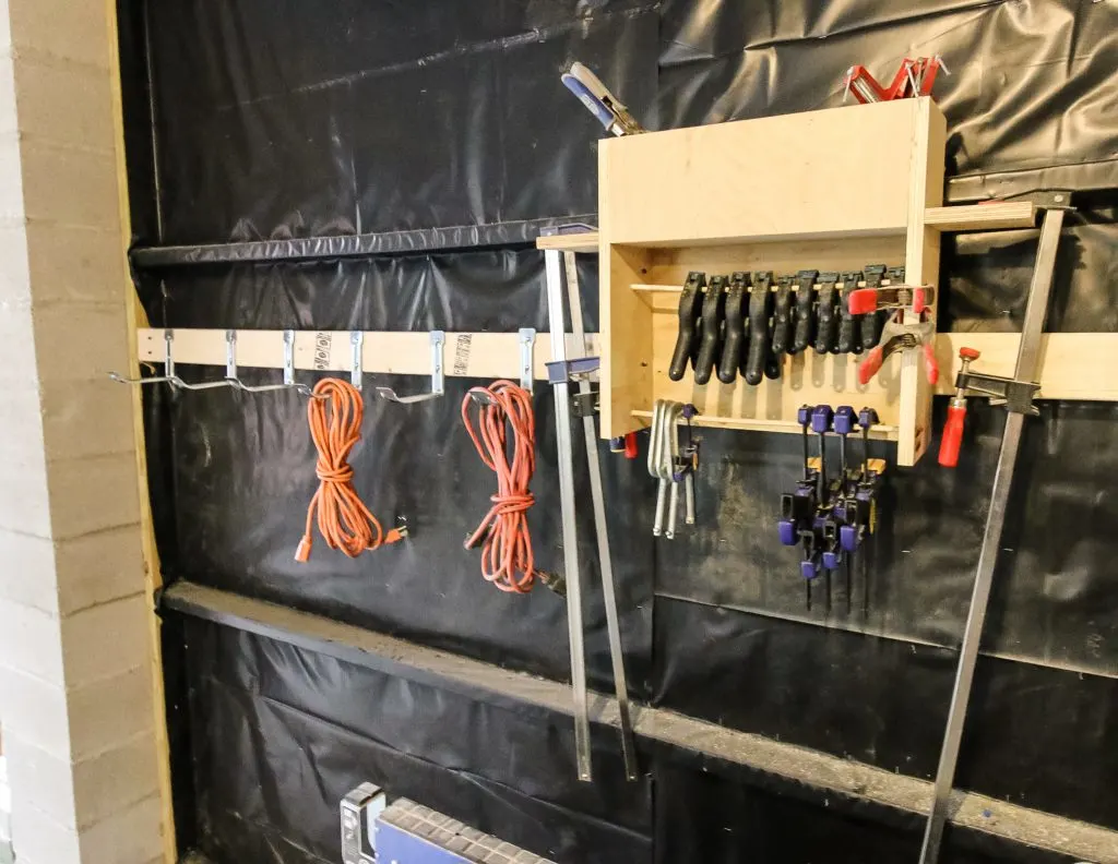 hang extension cords on the wall using these hooks