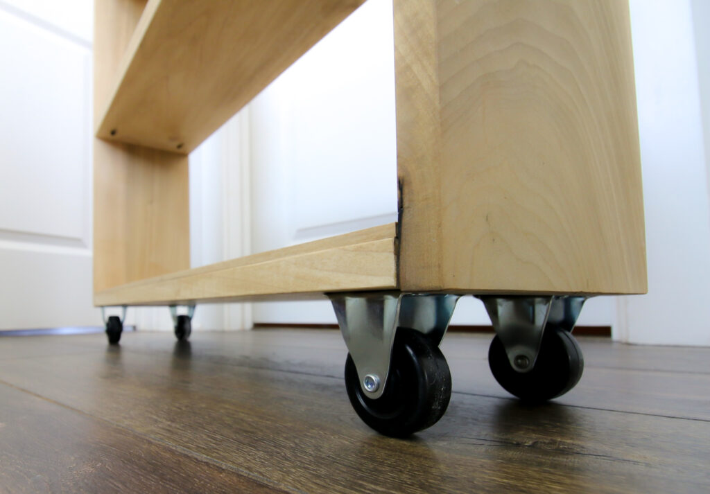 Casters on rolling laundry cart