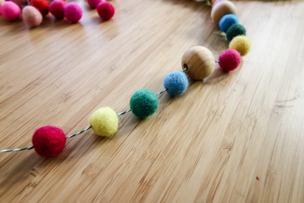 spaced out felt pom pom garland