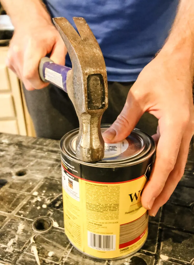 how to close a can of woodstain with a hammer