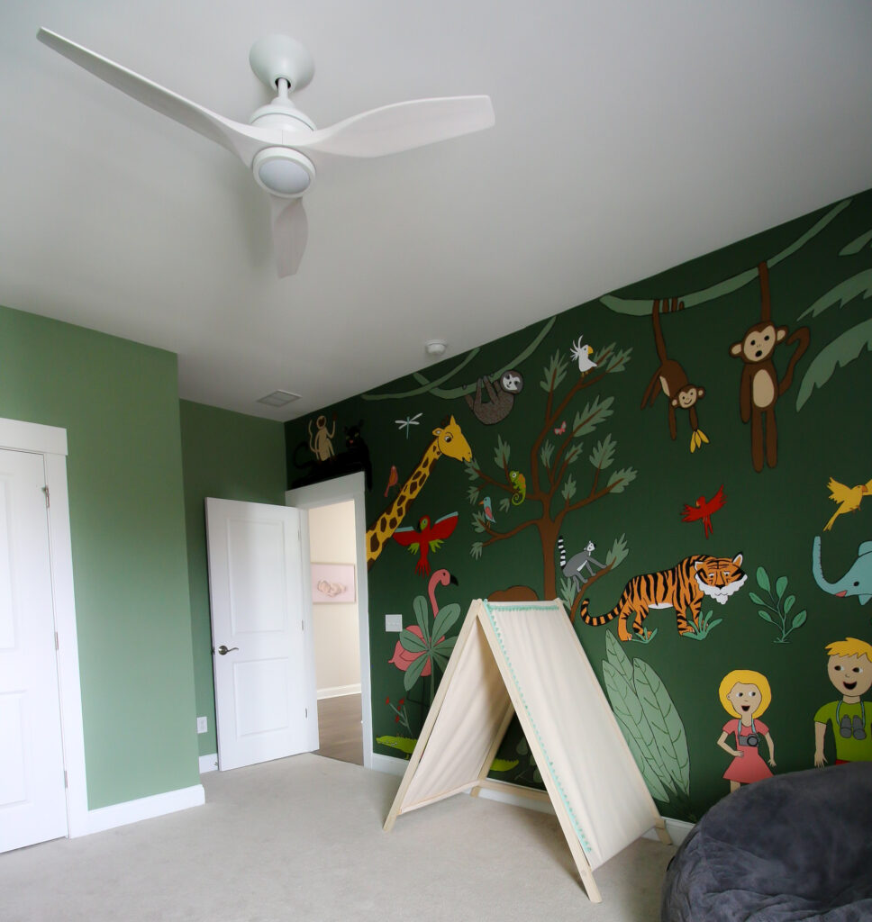 jungle themed nursery with spitfire fan by fanimation in white