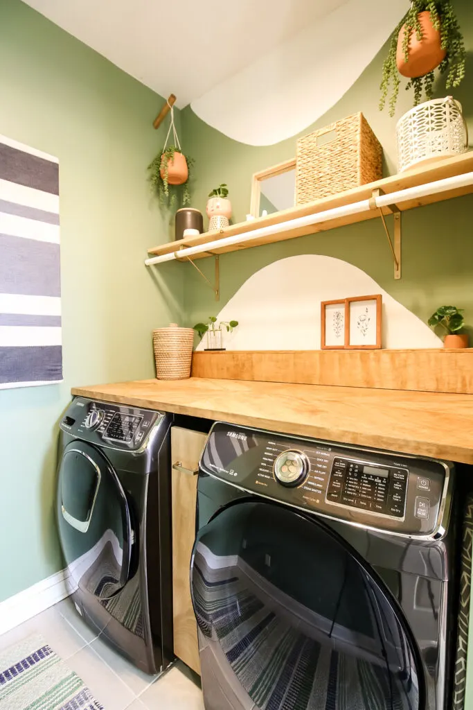 Rug hanging in boho laundry room