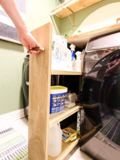 Rolling laundry cart being pulled out