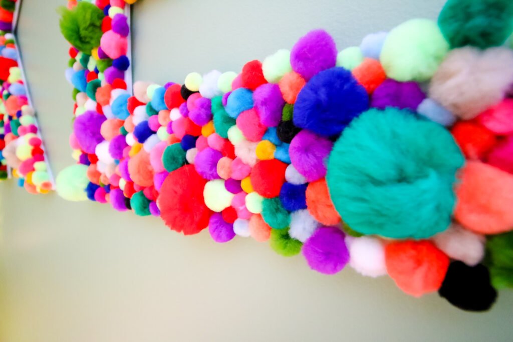 Close up of pom pom letters