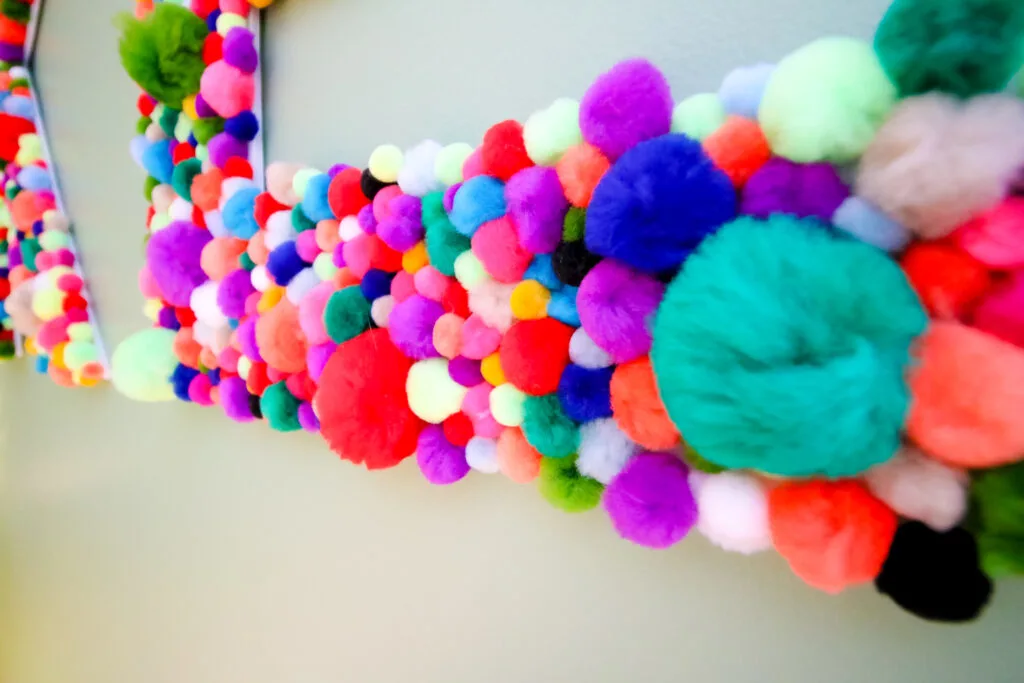 Close up of pom pom letters