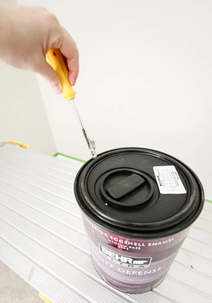 open a can of Behr paint with a screwdriver