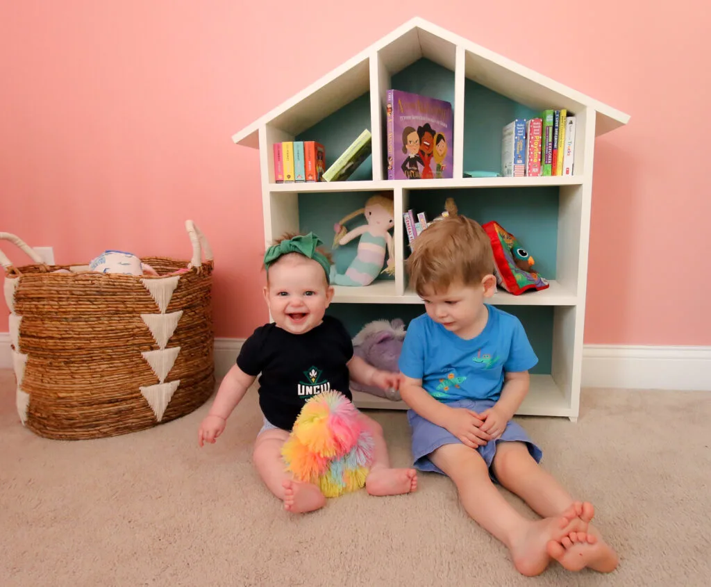 Luke and Rory with dollhouse bookshelf