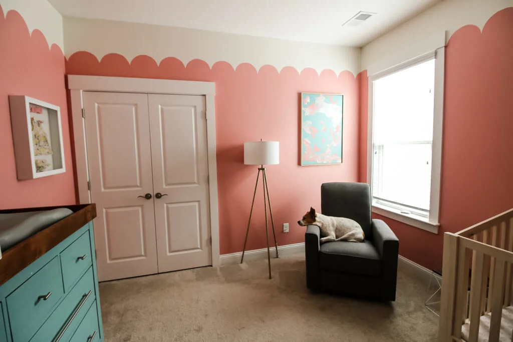 Wide angle shot of girls nursery with canvas