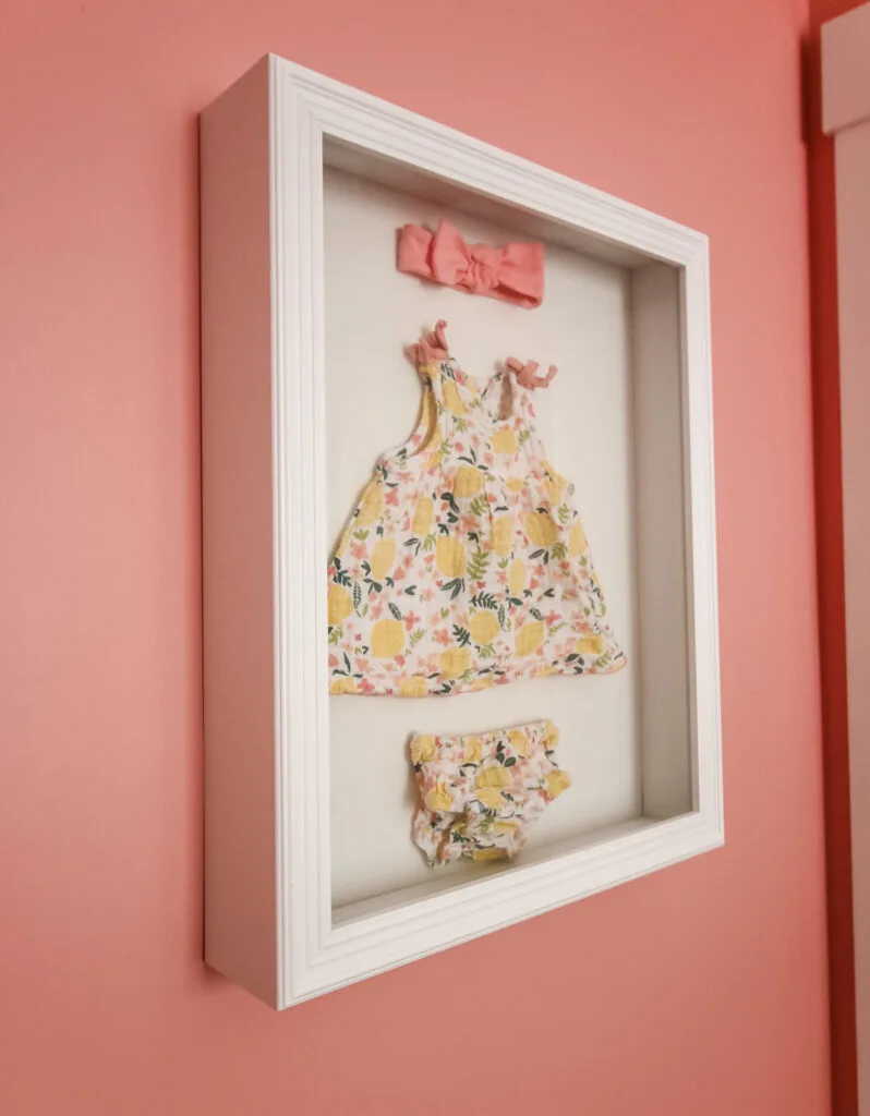 How to display baby clothes in a shadow box