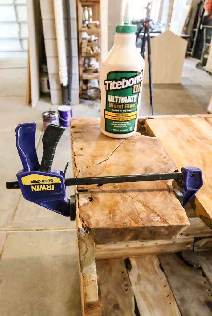 using wood glue and clamps to repair a wood table