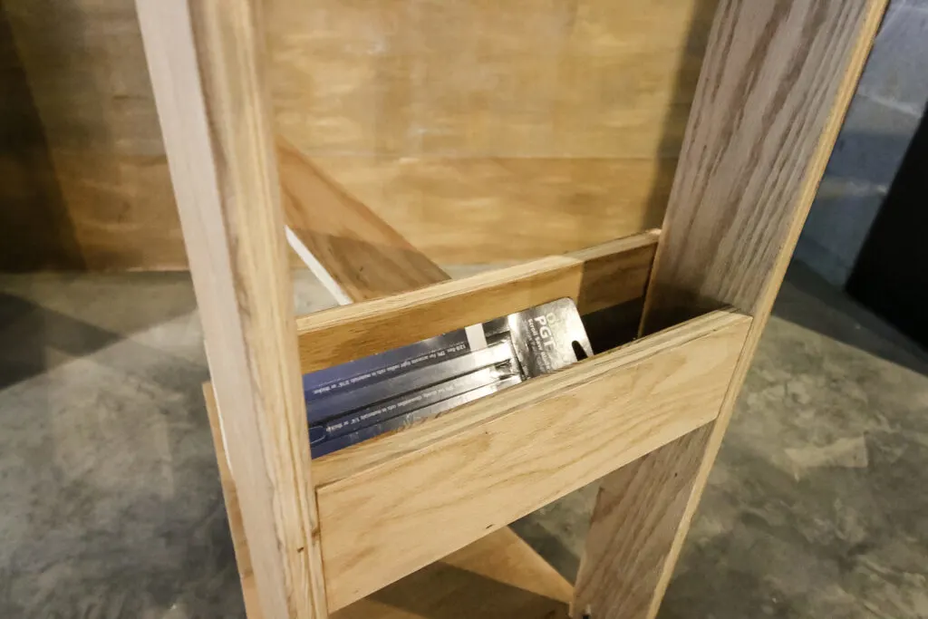 Storage bin on mobile scroll saw stand