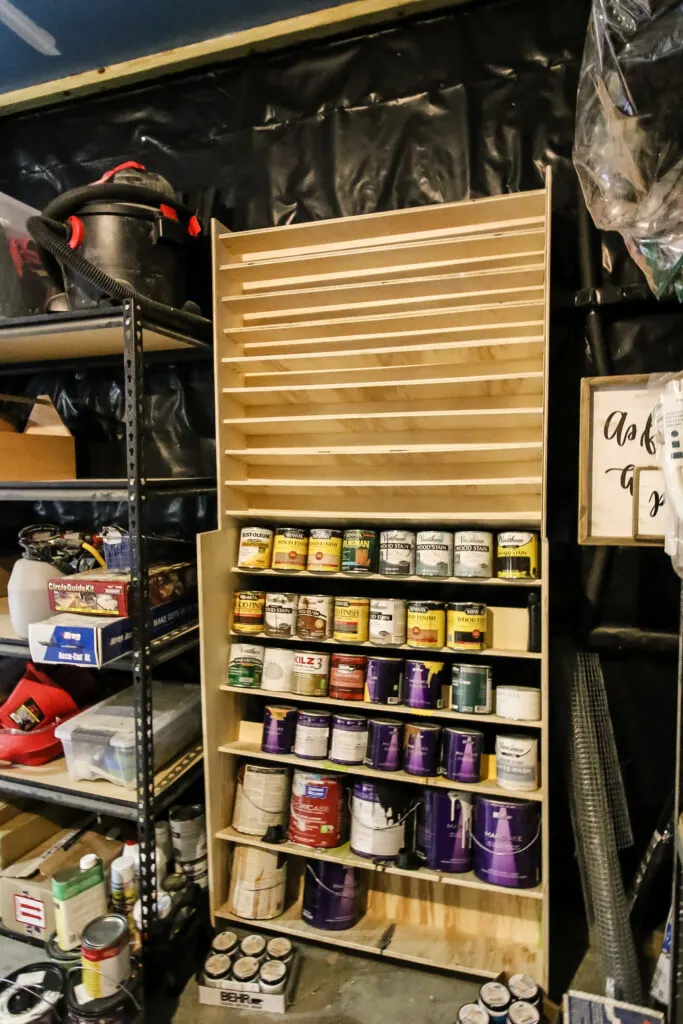 Attaching spray paint storage rack to wall