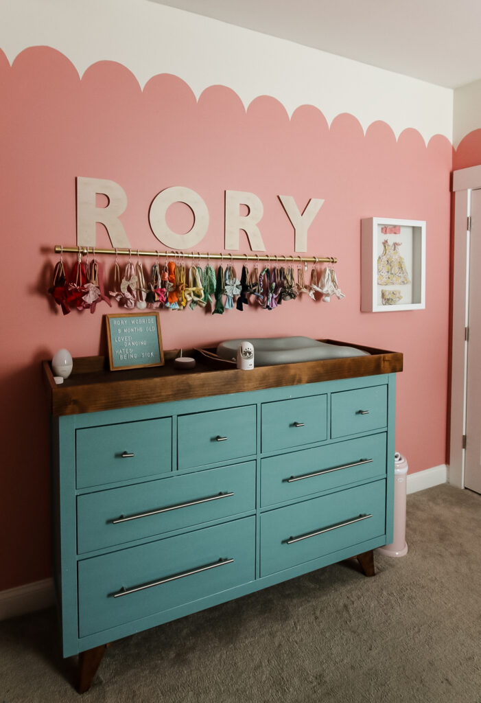 curtain rod used as baby headband storage