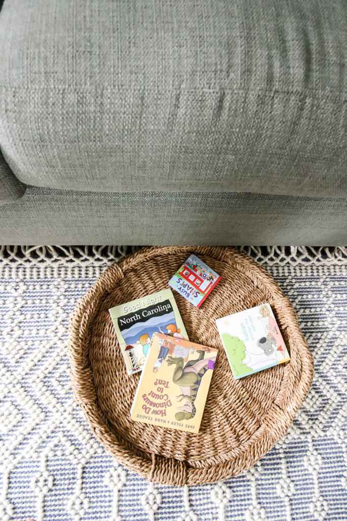 store books in a basket under the couch