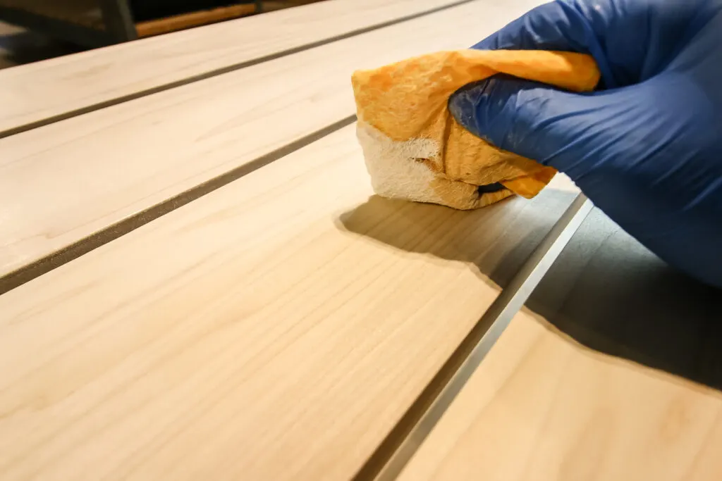 Buffing in Waterlox TRUETONE tung oil into coffee table