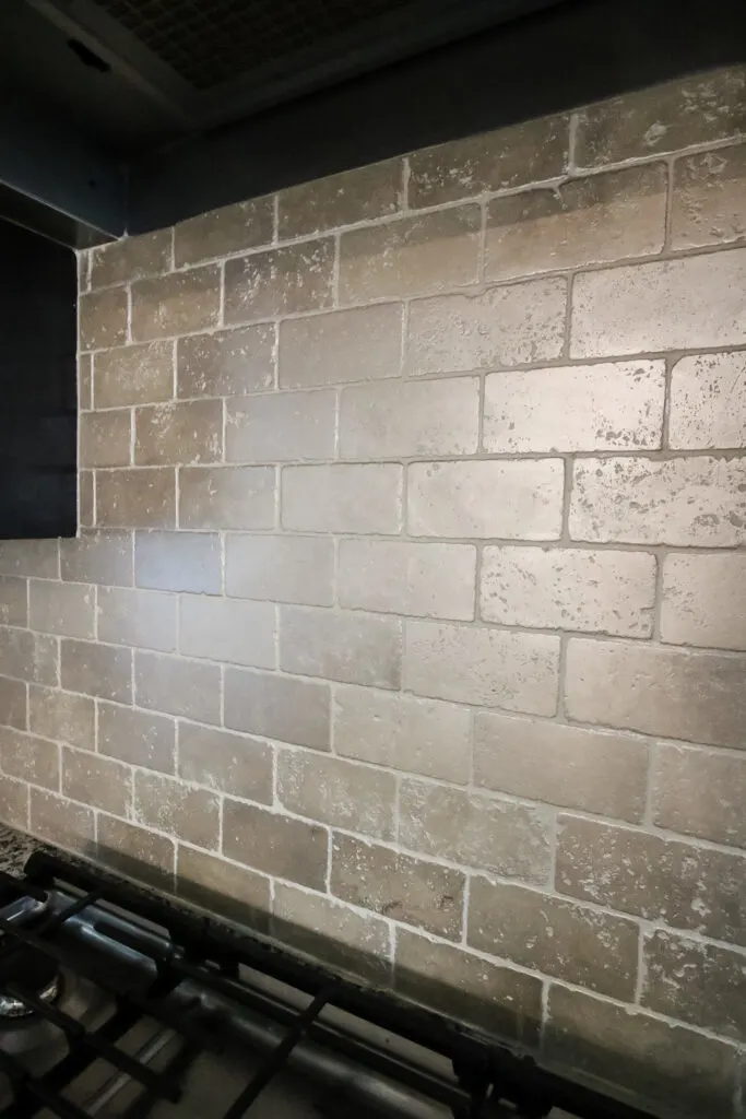 kitchen with painted tile backsplash