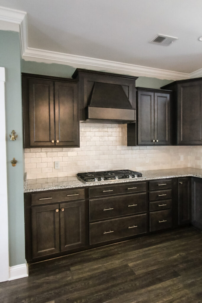 kitchen with painted tile backsplash