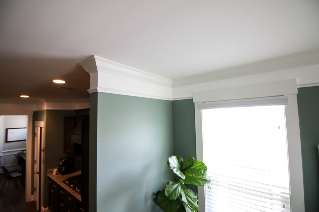 Crown molding expanded with paint and base cap molding