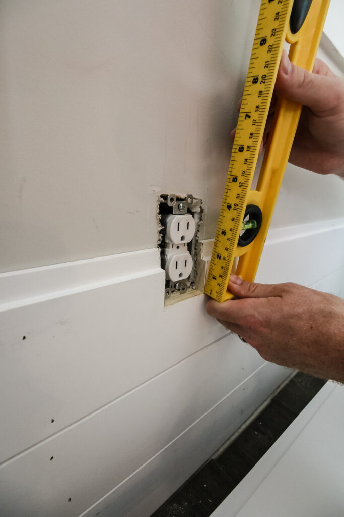 Measuring for outlet cutout on shiplap board