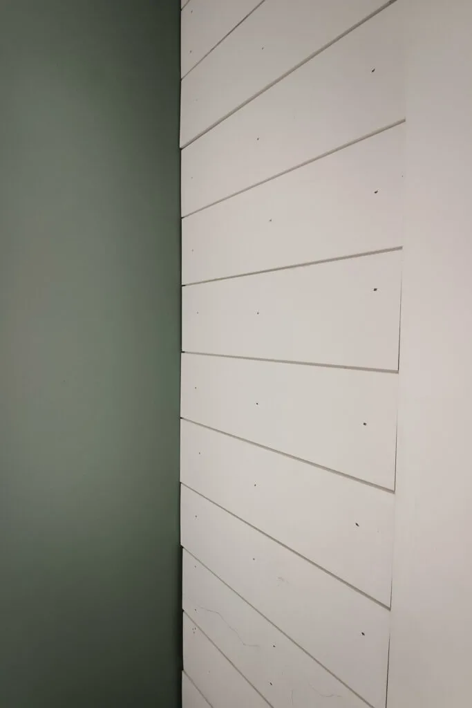 Installing shiplap boards on wall