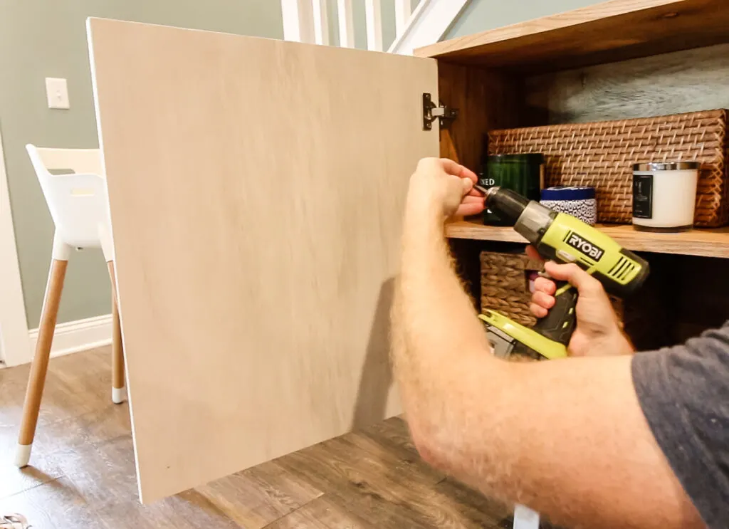 Attaching hinges to cabinet doors