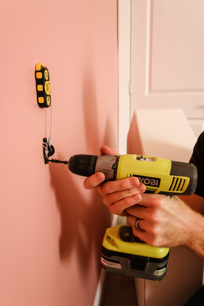 Attaching anti-tip kit to wall stud