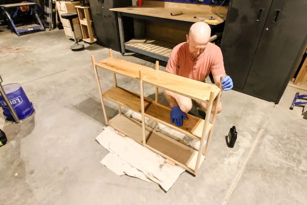 Applying Walrus Oil to oak dowel rod bookshelf