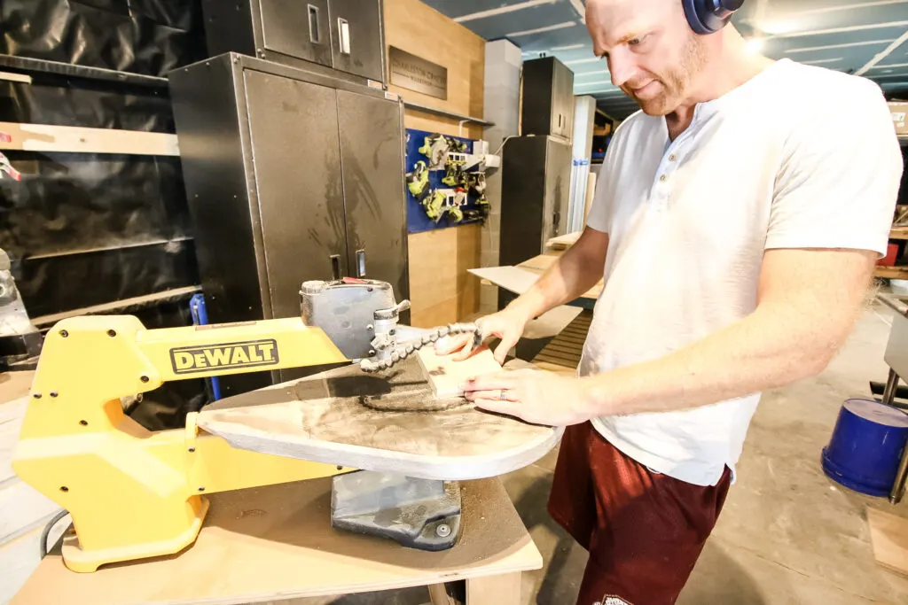 Cutting wooden legs on scroll saw