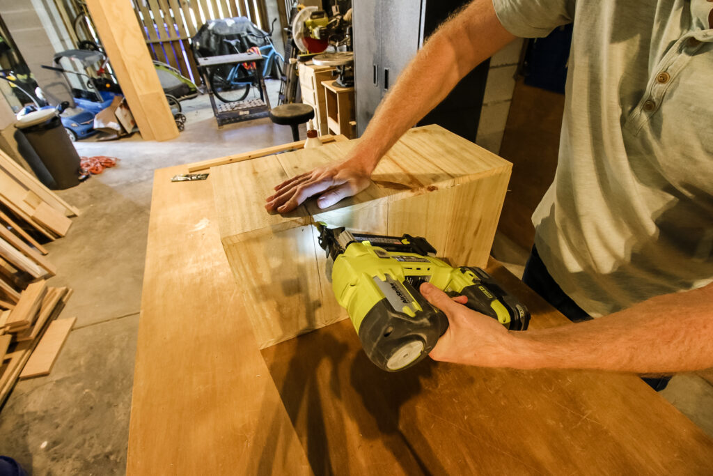 Attaching front panel of planter box to sides