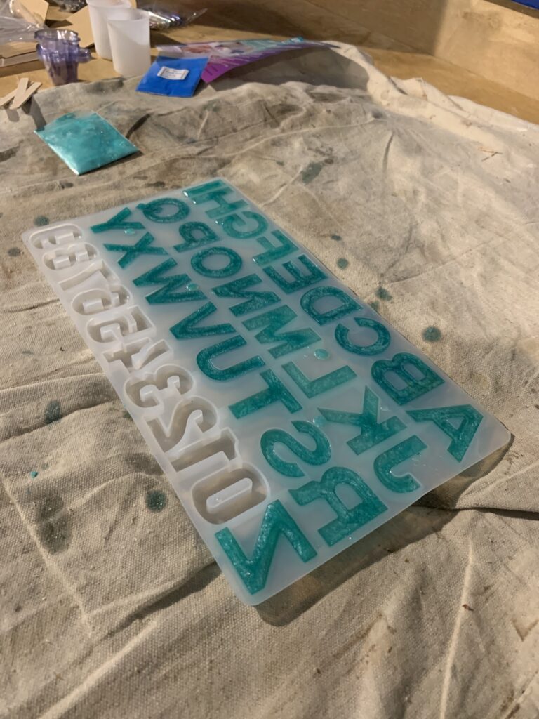 epoxy resin poured in silicone alphabet molds